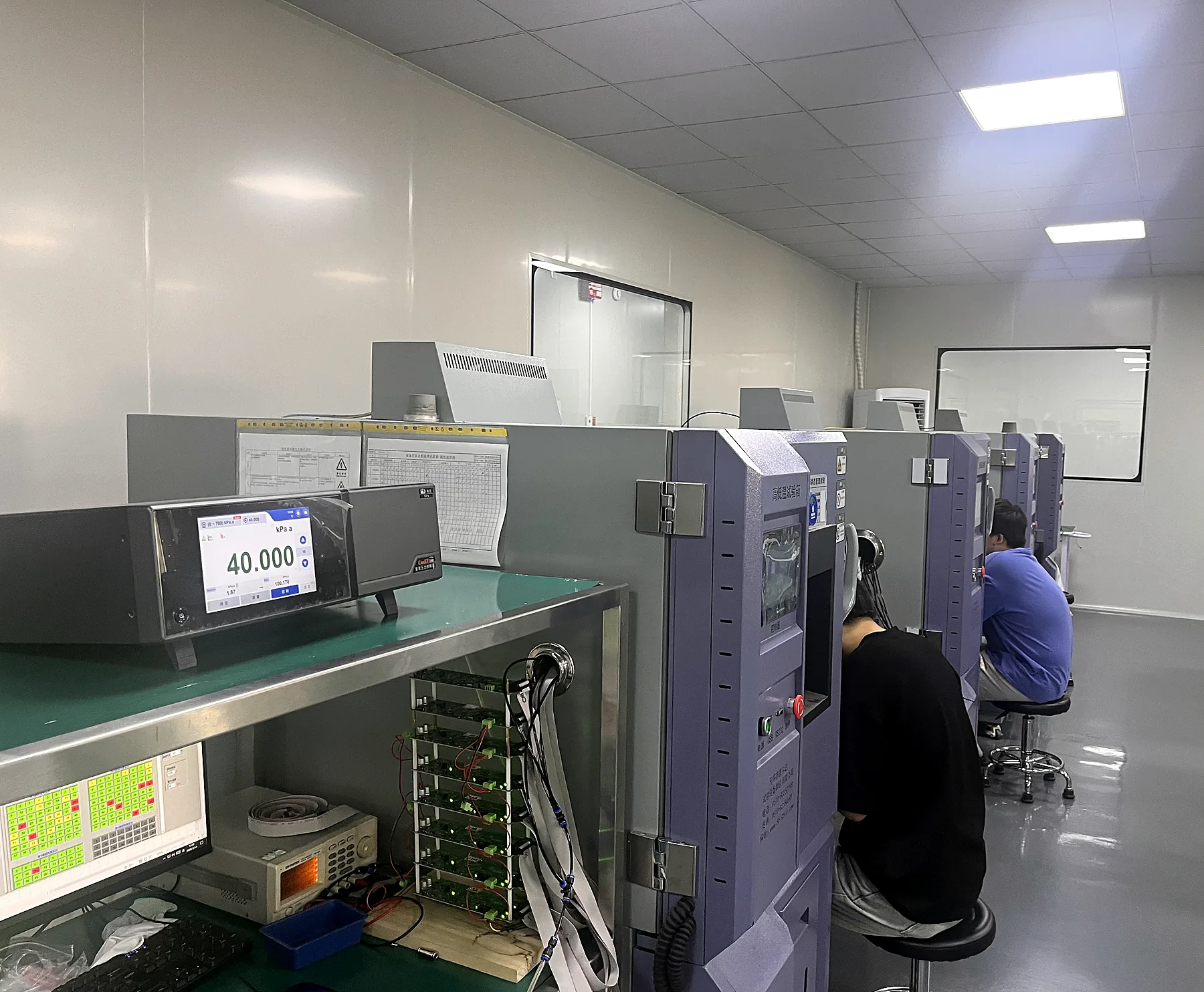 Reliava engineers calibrating and testing pressure sensor boards